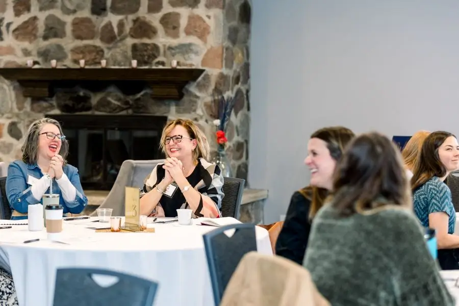 Participants of the CEO Summit sitting around a table